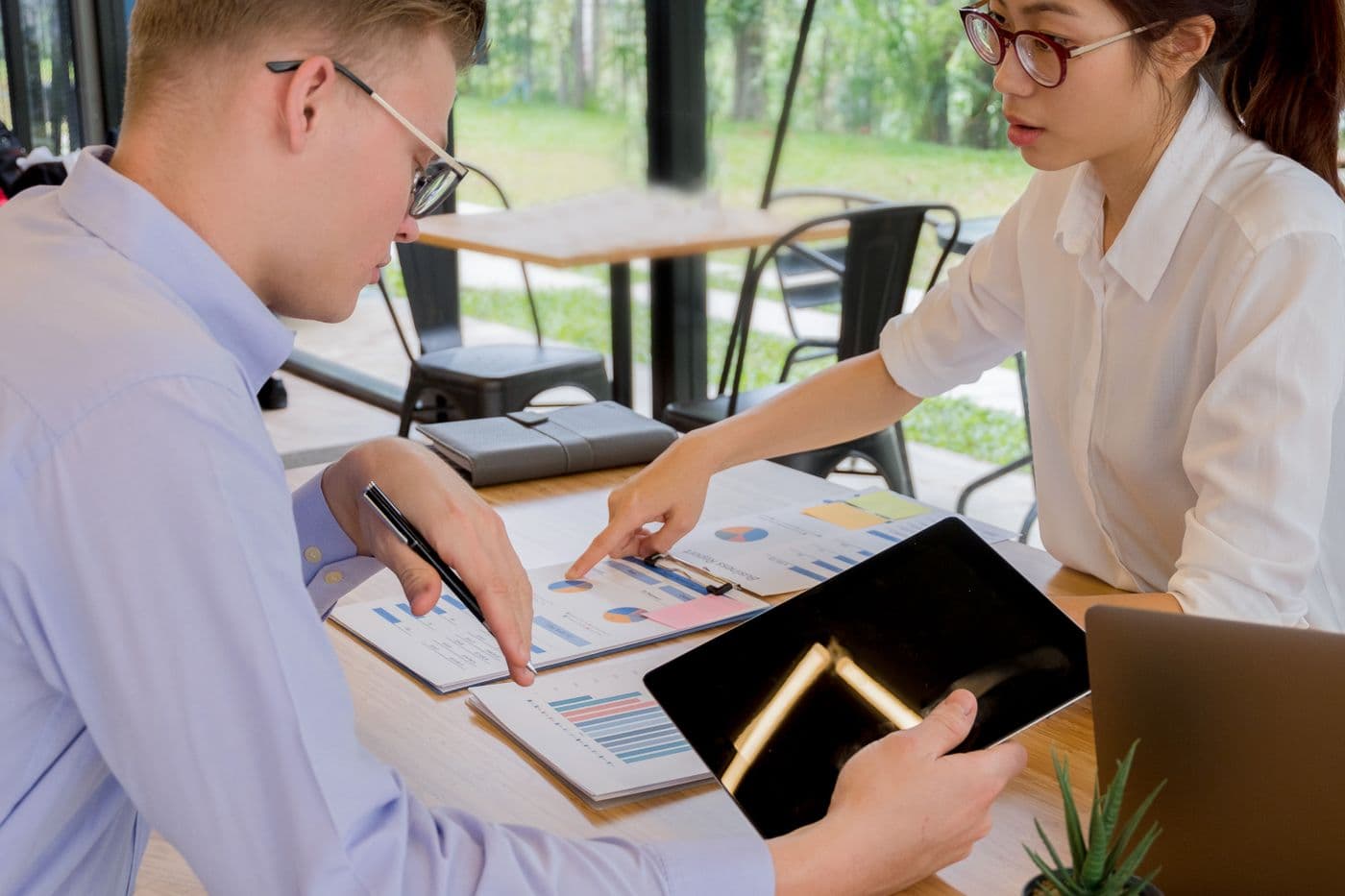 Two colleagues reviewing financials together